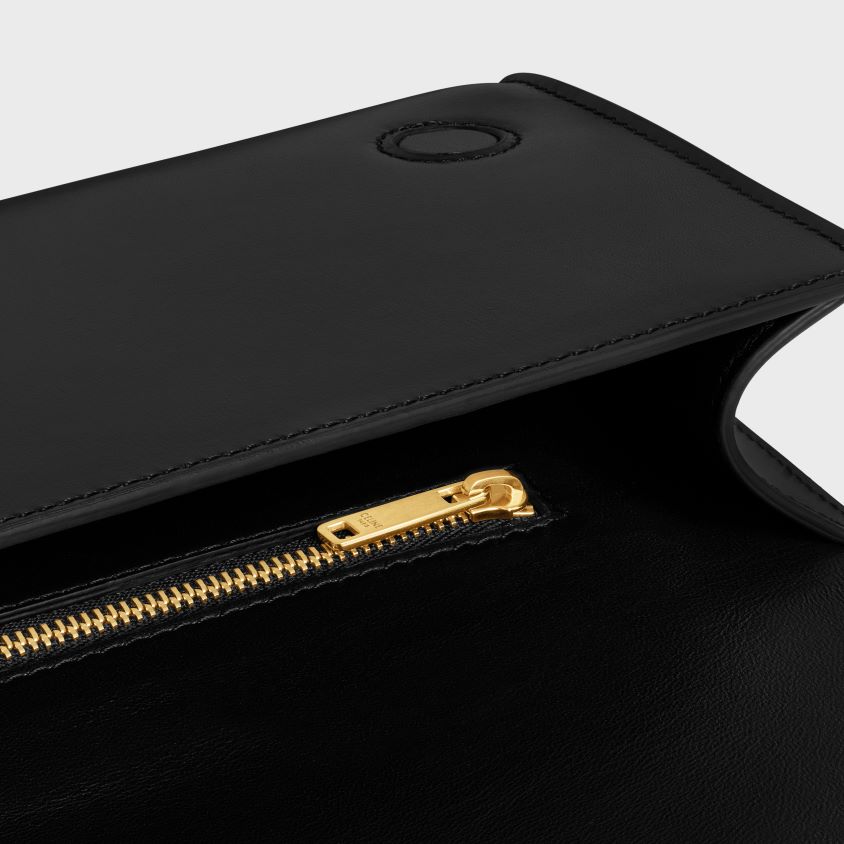 mulheres acessórios CELINE clutch assimétrica em couro de bezerro brilhante com estampa preto T204R279